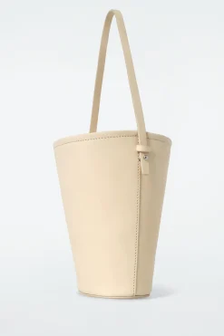 Sale COS MAŁA TOREBKA TYPU BUCKET Z NUBUKU Kremowy