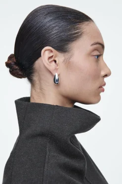 Online COS OVERSIZE'OWY TOP W JODEŁKĘ Z WYSOKIM KOŁNIERZEM