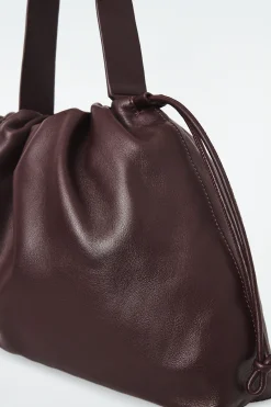 Best COS SKÓRZANA KOPERTÓWKA „CAVATELLI”
