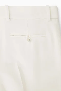 Clearance COS SPODNIE Z KREPY Z PROSTYMI NOGAWKAMI – RELAXED FIT