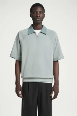New COS KOSZULKA POLO Z ZAMKIEM I EFEKTEM SPRANIA Niebieski