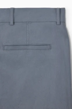 Fashion COS PROSTE ZWĘŻANE SPODNIE Z DIAGONALU – REGULAR FIT Niebieski