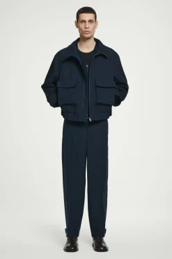 Sale COS SPODNIE CHINO Z NOGAWKAMI TYPU BARREL Granatowy