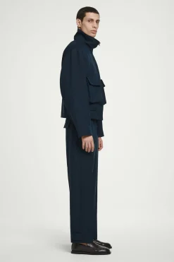 Sale COS SPODNIE CHINO Z NOGAWKAMI TYPU BARREL Granatowy